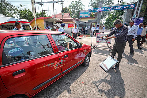 Security personnel checks a vehicle in Jammu